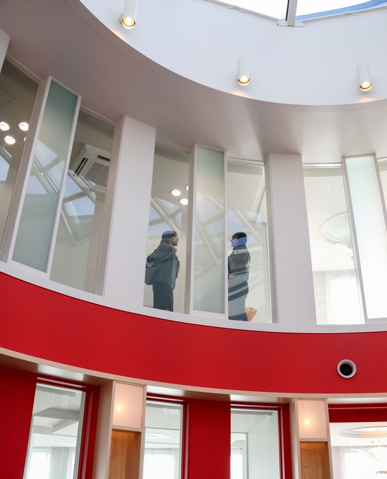 view of two people through windows of TUJ Kyoto campus