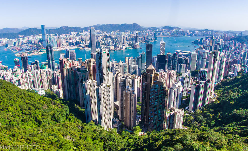aerial view of Hong Kong showing tall buildings with water in the background