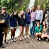 Dean Mostafa with students in Costa Rica, waterfall behind