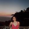 Photo of Arissa in front of the sunset in Cinqueterre, Italy