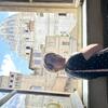 Photo of Allison inside the Vatican Museums with St. Peter's Basilica in the background