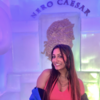 Photo of Nidhi in front of a wall of ice in Rome, Italy