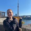 Photo of Keira standing in front of the Tokyo Skytree in Japan